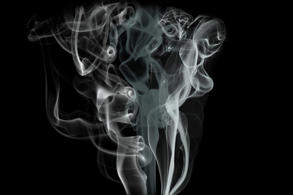 smoke on dark background, representing radon inhalation
